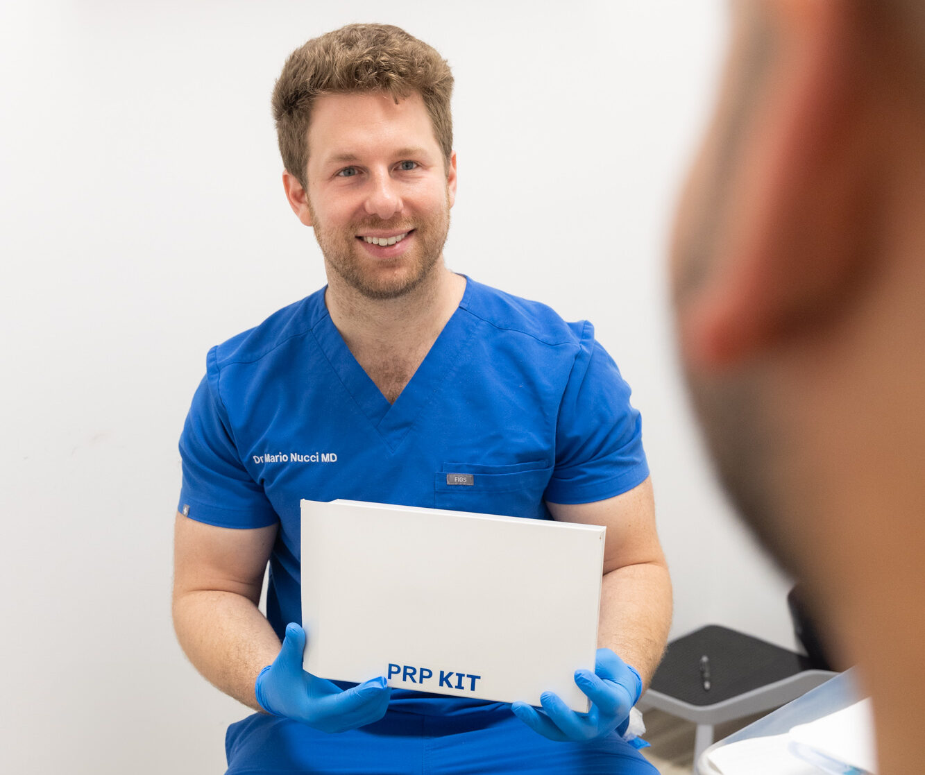 A member of our team smiles as he discusses PRP hair treatment in Thunder Bay, ON